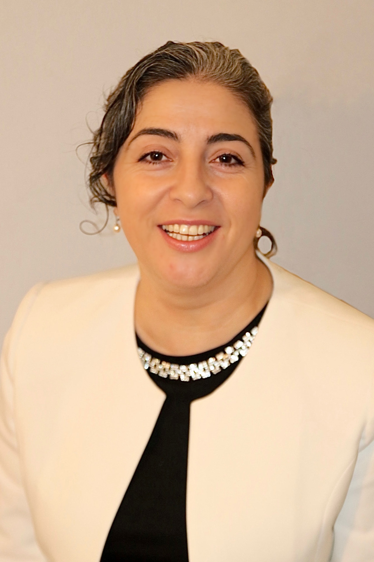 Professional headshot of Ozlem Barnard